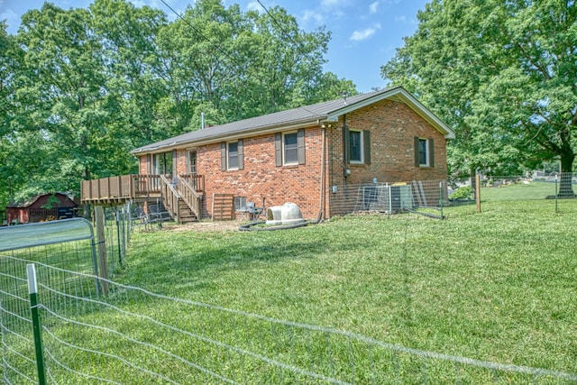260 Fate Ivy Rd, Monterey, TN 38574 - back of property featuring brick siding, a deck, stairs, and metal roof
