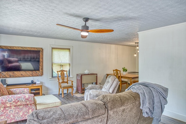 260 Fate Ivy Rd, Monterey, TN 38574 - living area featuring wood finished floors, a textured ceiling, ceiling fan, baseboards, and ornamental molding