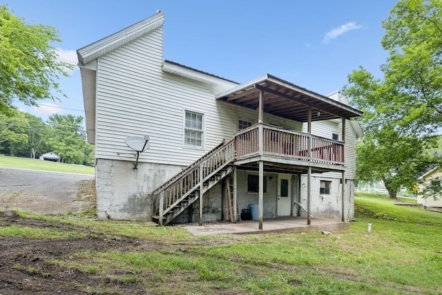 1319 Main St N, Carthage, TN 37030 - back of house with a deck, a patio, a lawn, and stairway