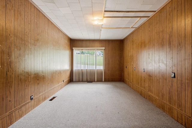 1319 Main St N, Carthage, TN 37030 - carpeted empty room with wooden walls