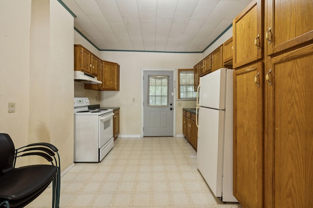 1319 Main St N, Carthage, TN 37030 - kitchen with white appliances, under cabinet range hood, light floors, and brown cabinets
