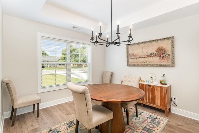 3019 Easy Goer Ln, Greenbrier, TN 37073 - dining area featuring a chandelier, baseboards, and light wood-type flooring