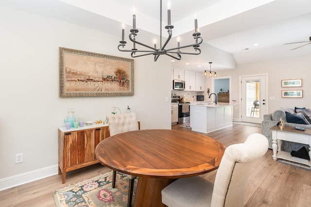 3019 Easy Goer Ln, Greenbrier, TN 37073 - dining room featuring a chandelier, light wood-type flooring, lofted ceiling, baseboards, and ceiling fan