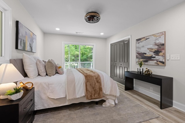 2605 Avalon Hl, Chattanooga, TN 37415 - bedroom featuring light wood-type flooring, access to exterior, a closet, baseboards, and recessed lighting