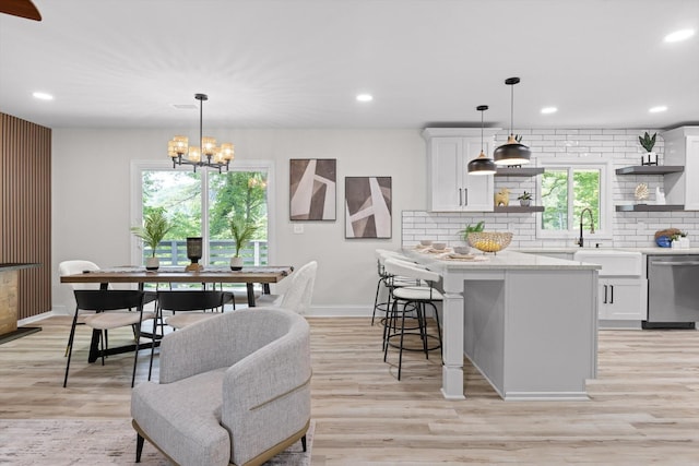 2605 Avalon Hl, Chattanooga, TN 37415 - dining space with baseboards, light wood finished floors, recessed lighting, and a chandelier