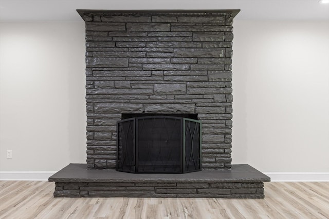 2605 Avalon Hl, Chattanooga, TN 37415 - detailed view of a fireplace, wood finished floors, and baseboards