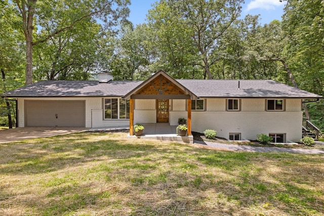 2605 Avalon Hl, Chattanooga, TN 37415 - view of front facade with an attached garage, a chimney, concrete driveway, a front lawn, and brick siding