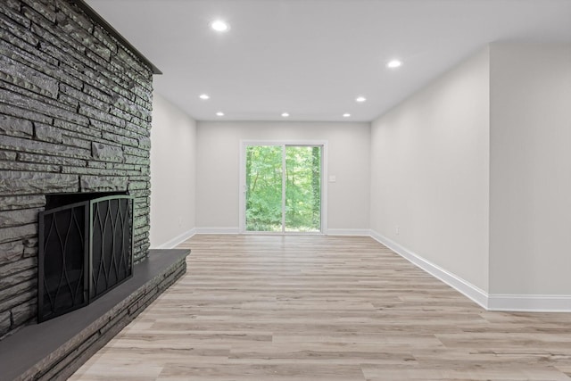 2605 Avalon Hl, Chattanooga, TN 37415 - unfurnished living room featuring wood finished floors, recessed lighting, a stone fireplace, and baseboards
