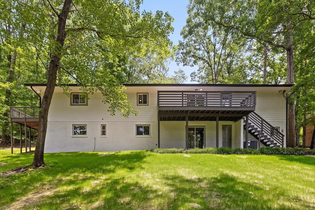 2605 Avalon Hl, Chattanooga, TN 37415 - rear view of house with a wooden deck, stairway, and a yard