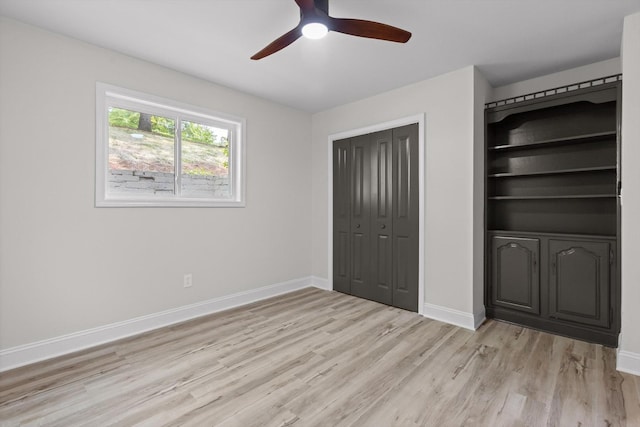 2605 Avalon Hl, Chattanooga, TN 37415 - unfurnished bedroom featuring light wood finished floors, baseboards, a closet, and a ceiling fan