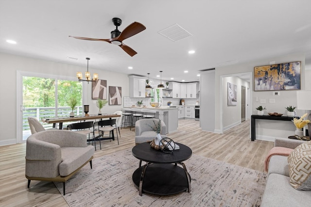2605 Avalon Hl, Chattanooga, TN 37415 - living area featuring a chandelier, light wood finished floors, baseboards, ceiling fan, and recessed lighting