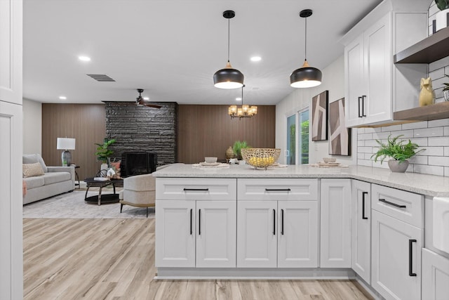 2605 Avalon Hl, Chattanooga, TN 37415 - kitchen with open shelves, a peninsula, a ceiling fan, open floor plan, and white cabinets