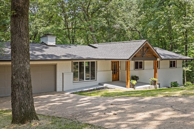 2605 Avalon Hl, Chattanooga, TN 37415 - single story home featuring brick siding, an attached garage, a chimney, and a shingled roof