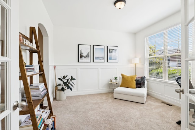 1074 Cantwell Pl, Spring Hill, TN 37174 - living area featuring a decorative wall, carpet, and a wainscoted wall
