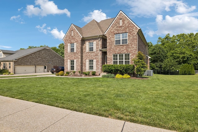 1074 Cantwell Pl, Spring Hill, TN 37174 - view of front of house featuring brick siding, a front lawn, a garage, and central AC