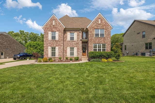 1074 Cantwell Pl, Spring Hill, TN 37174 - view of front of home featuring brick siding, a front lawn, and a shingled roof
