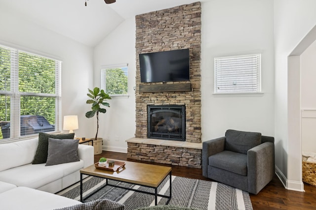 1074 Cantwell Pl, Spring Hill, TN 37174 - living room with dark wood-type flooring, ceiling fan, a stone fireplace, baseboards, and high vaulted ceiling