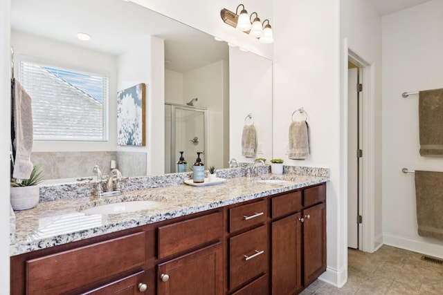 1074 Cantwell Pl, Spring Hill, TN 37174 - bathroom with a shower stall, double vanity, a garden tub, and tile patterned flooring