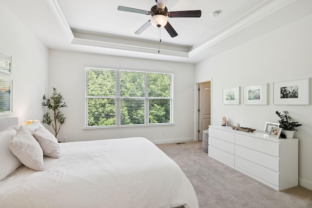 1074 Cantwell Pl, Spring Hill, TN 37174 - bedroom featuring a tray ceiling, light colored carpet, ornamental molding, a ceiling fan, and baseboards