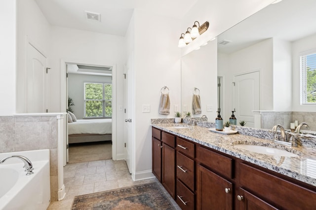 1074 Cantwell Pl, Spring Hill, TN 37174 - full bathroom featuring double vanity, a bath, plenty of natural light, and ensuite bathroom