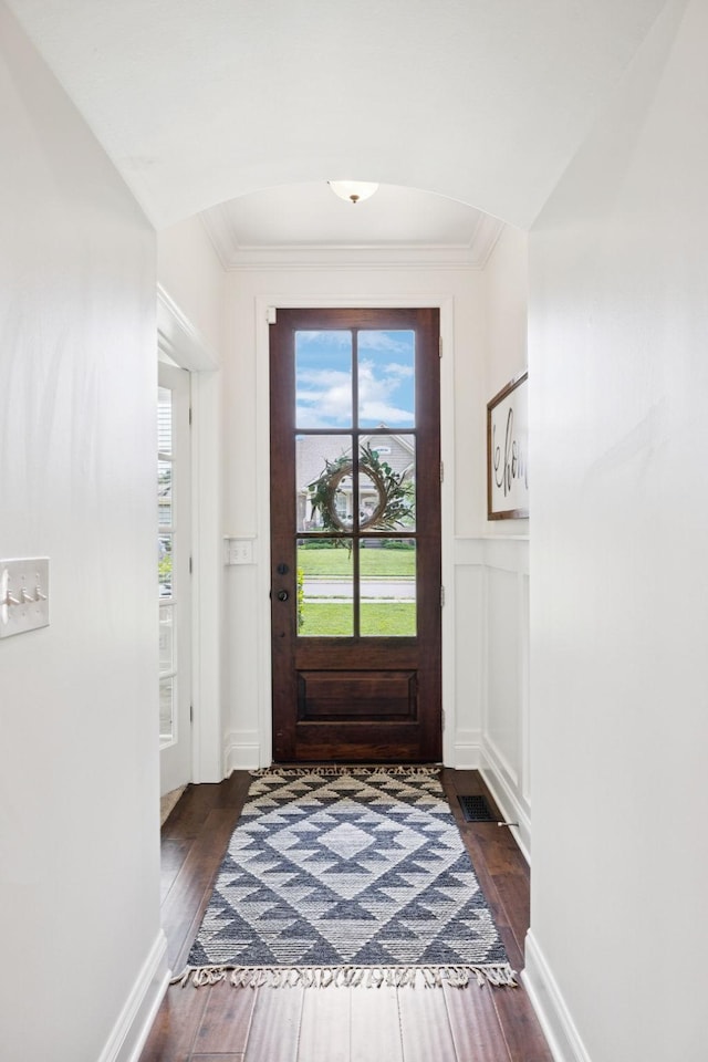 1074 Cantwell Pl, Spring Hill, TN 37174 - foyer entrance featuring ornamental molding, dark wood-style flooring, wainscoting, and a decorative wall