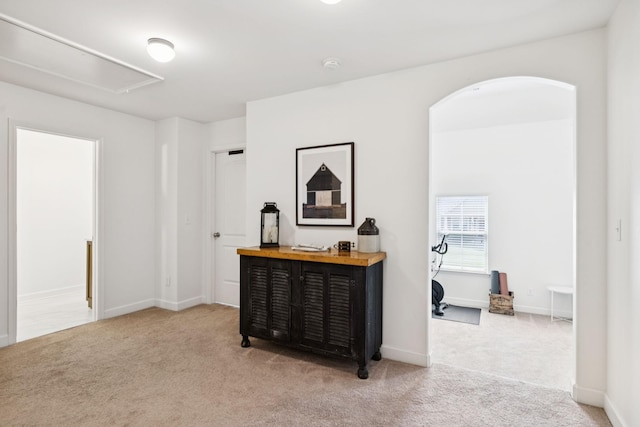1074 Cantwell Pl, Spring Hill, TN 37174 - hall featuring attic access, light colored carpet, arched walkways, and baseboards