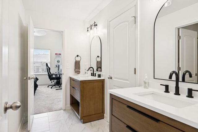 1074 Cantwell Pl, Spring Hill, TN 37174 - full bathroom featuring two vanities, marble look tiles, and baseboards