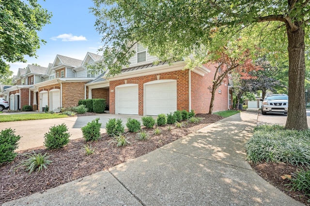 2342 N Tennessee Blvd Unit 601, Murfreesboro, TN 37130 - view of front of home with concrete driveway, an attached garage, and brick siding