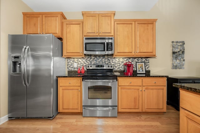 2342 N Tennessee Blvd Unit 601, Murfreesboro, TN 37130 - kitchen with stainless steel appliances, dark stone countertops, light wood-style flooring, and tasteful backsplash