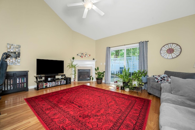 2342 N Tennessee Blvd Unit 601, Murfreesboro, TN 37130 - living area featuring a ceiling fan, a glass covered fireplace, high vaulted ceiling, and wood finished floors