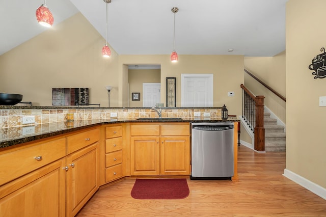 2342 N Tennessee Blvd Unit 601, Murfreesboro, TN 37130 - kitchen with stainless steel dishwasher, a sink, light wood-type flooring, decorative light fixtures, and dark stone countertops