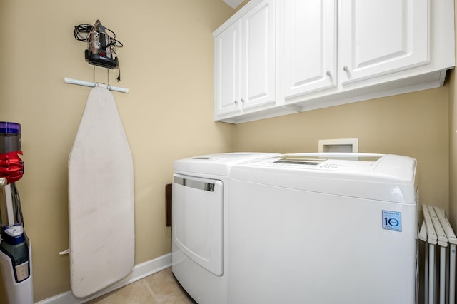 2342 N Tennessee Blvd Unit 601, Murfreesboro, TN 37130 - laundry room with washing machine and clothes dryer, cabinet space, light tile patterned flooring, and baseboards