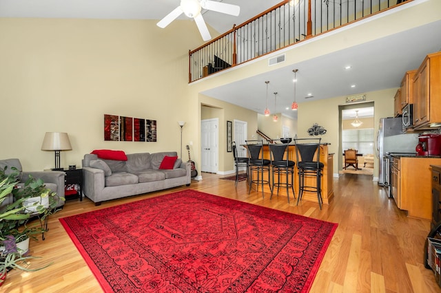 2342 N Tennessee Blvd Unit 601, Murfreesboro, TN 37130 - living room featuring ceiling fan, light wood-style flooring, and a high ceiling