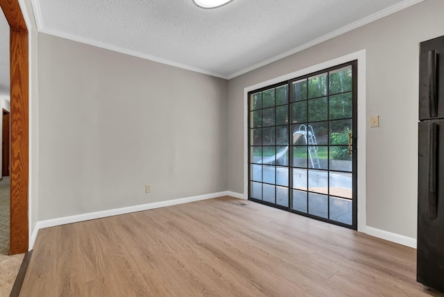 5595 Denmark Rd, Erin, TN 37061 - unfurnished room featuring wood finished floors, ornamental molding, a textured ceiling, and baseboards