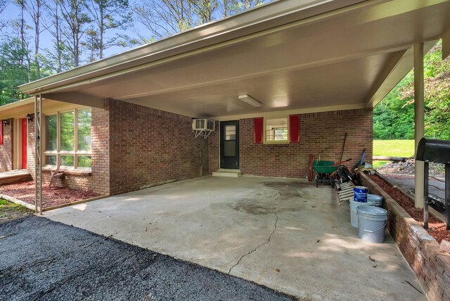 5595 Denmark Rd, Erin, TN 37061 - view of patio with an attached carport and an AC wall unit
