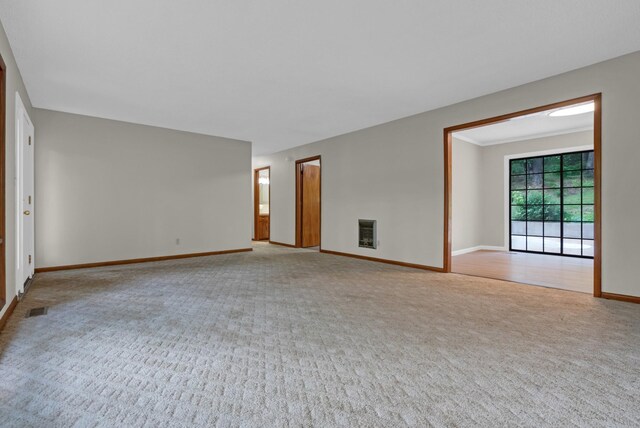 5595 Denmark Rd, Erin, TN 37061 - spare room featuring carpet floors, heating unit, and baseboards