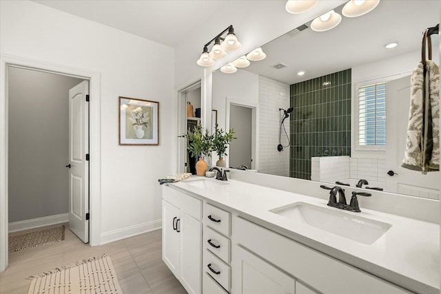 3205 Vinemont Dr, Thompsons Station, TN 37179 - full bath with double vanity, a walk in shower, baseboards, and tile patterned floors