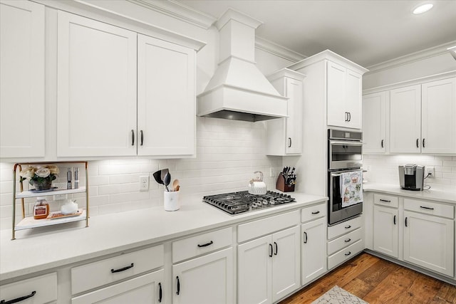 3205 Vinemont Dr, Thompsons Station, TN 37179 - kitchen with appliances with stainless steel finishes, custom range hood, backsplash, ornamental molding, and light countertops