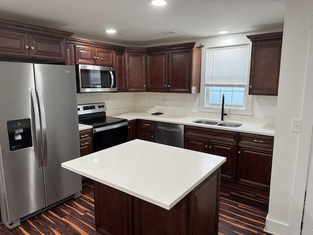 414 Washington St, Columbia, TN 38401 - kitchen featuring appliances with stainless steel finishes, a sink, dark wood-style floors, dark brown cabinetry, and recessed lighting