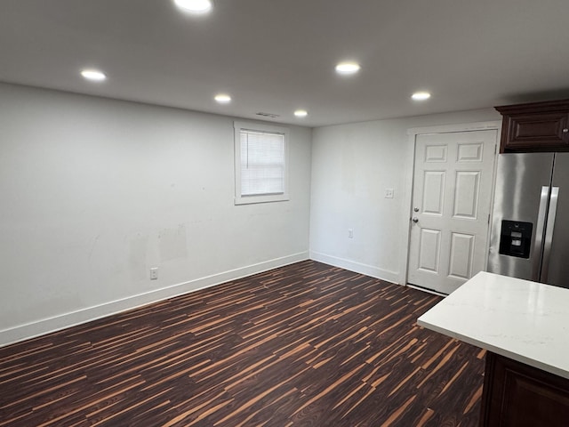 414 Washington St, Columbia, TN 38401 - kitchen featuring stainless steel refrigerator with ice dispenser, baseboards, dark wood-style floors, recessed lighting, and light stone counters