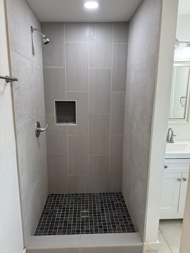 414 Washington St, Columbia, TN 38401 - full bathroom featuring tiled shower, vanity, and tile patterned floors