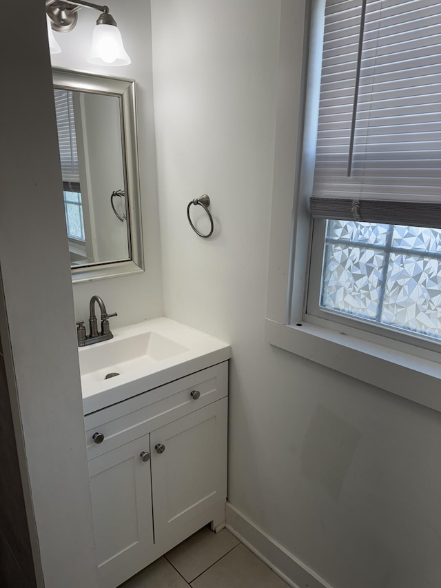 414 Washington St, Columbia, TN 38401 - bathroom featuring tile patterned floors, vanity, and baseboards