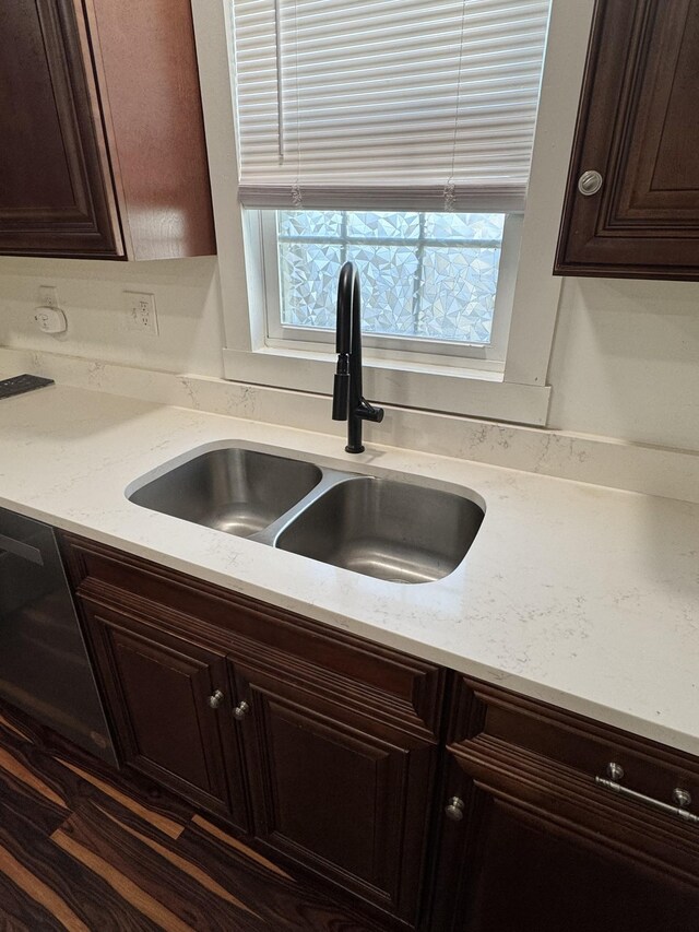 414 Washington St, Columbia, TN 38401 - kitchen featuring a sink, dark brown cabinetry, and light stone countertops
