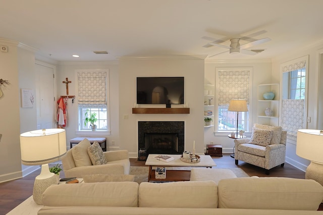 307 Seven Springs Way Unit 304, Brentwood, TN 37027 - living room with healthy amount of natural light, ornamental molding, a ceiling fan, dark wood-style floors, and a fireplace with flush hearth