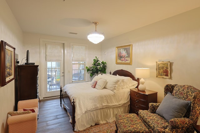 307 Seven Springs Way Unit 304, Brentwood, TN 37027 - bedroom featuring wood finished floors and access to exterior