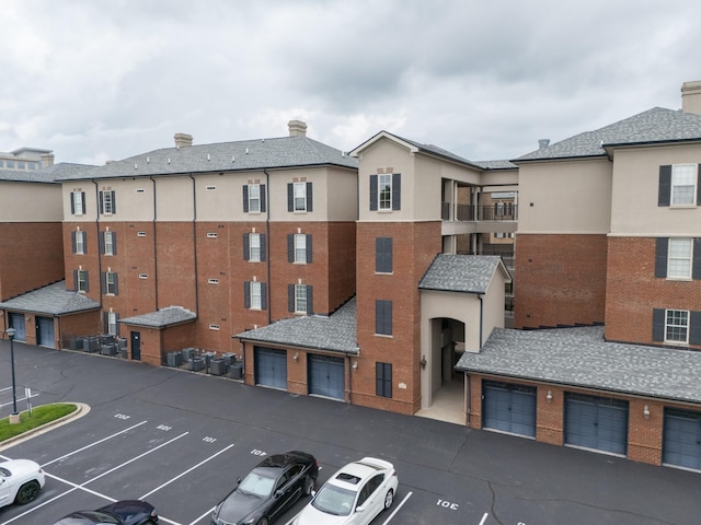307 Seven Springs Way Unit 304, Brentwood, TN 37027 - view of building exterior featuring uncovered parking