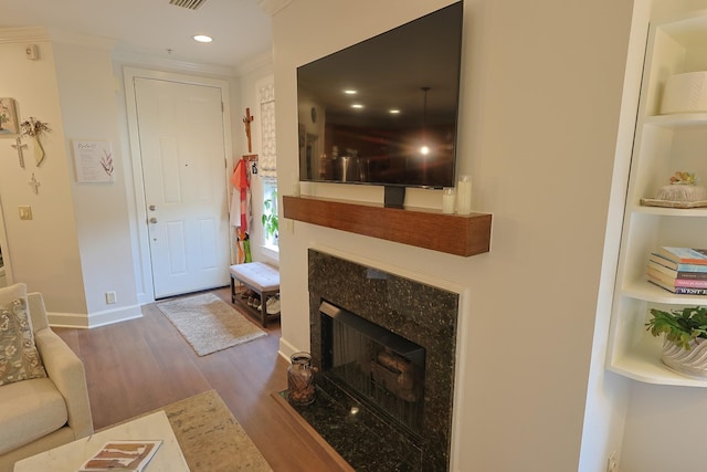 307 Seven Springs Way Unit 304, Brentwood, TN 37027 - living area with wood finished floors, crown molding, recessed lighting, built in features, and a premium fireplace