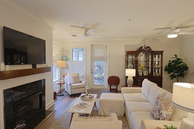 307 Seven Springs Way Unit 304, Brentwood, TN 37027 - living room with a ceiling fan, a premium fireplace, dark wood-type flooring, crown molding, and baseboards