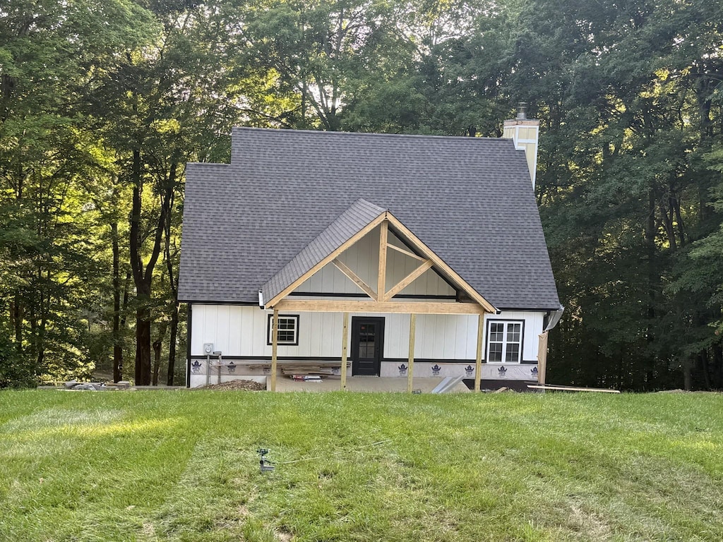 1530 Ridgeview Run, Lynchburg, TN 37352 - view of front of property featuring a shingled roof, a front lawn, and a chimney