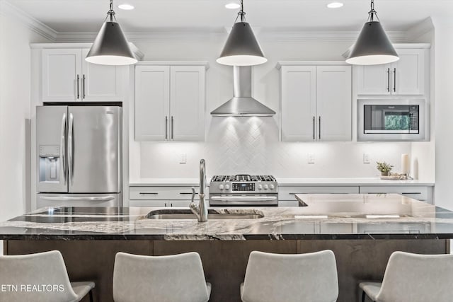 9327 Paradise Valley Ln, Knoxville, TN 37922 - kitchen with appliances with stainless steel finishes, a breakfast bar area, hanging light fixtures, white cabinetry, and recessed lighting